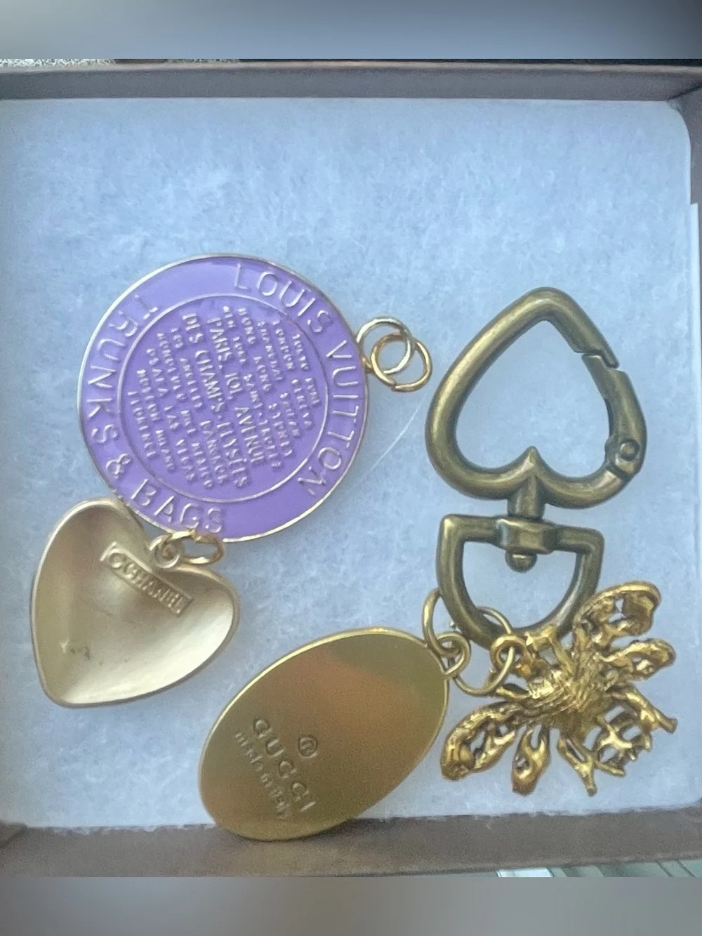 Louis Vuitton Lavender Charm, Chanel button, and Gucci bag charm. Vintage